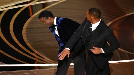 (FILES) In this file photo taken on March 27, 2022 US actor Will Smith (R) slaps US actor Chris Rock onstage during the 94th Oscars at the Dolby Theatre in Hollywood, California. The Oscars were in desperate need of a ratings boost -- and, on a night when Will Smith stunned viewers by slapping Chris Rock on stage, some 15.36 million Americans tuned in. (Photo by Robyn Beck / AFP)